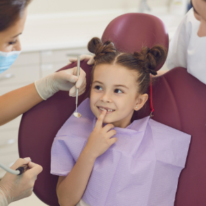 Child in dentist chair having appointment with a children's dentist